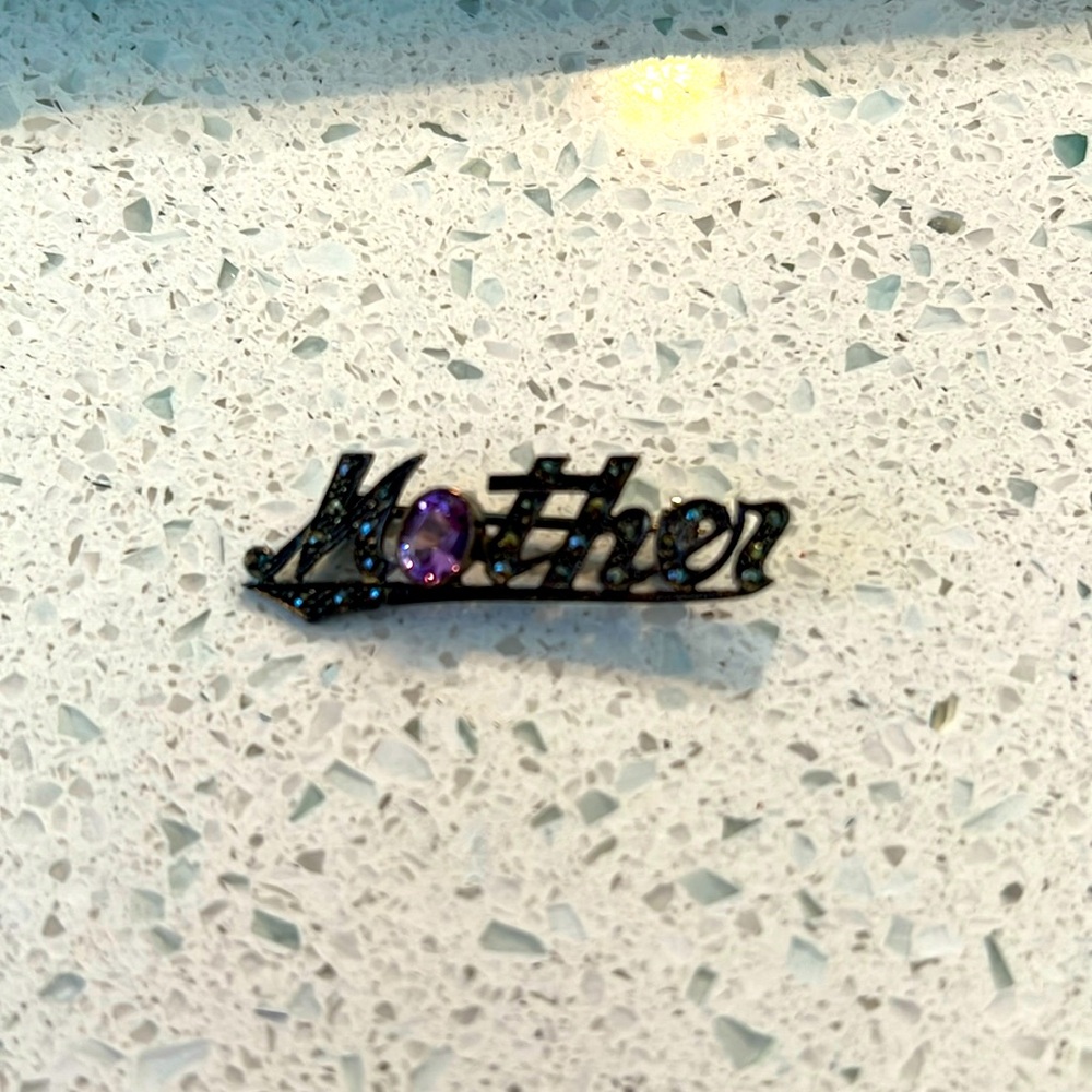 Mother brooch with simulated amethyst and marcasite